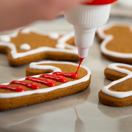 Cold Brew Gingerbread Cookies with white and red frosting